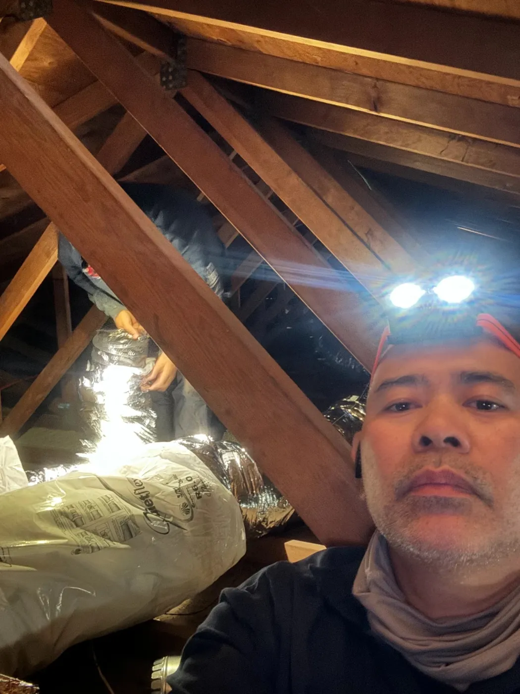 CrossBreeze crew running insulation in a San Diego attic