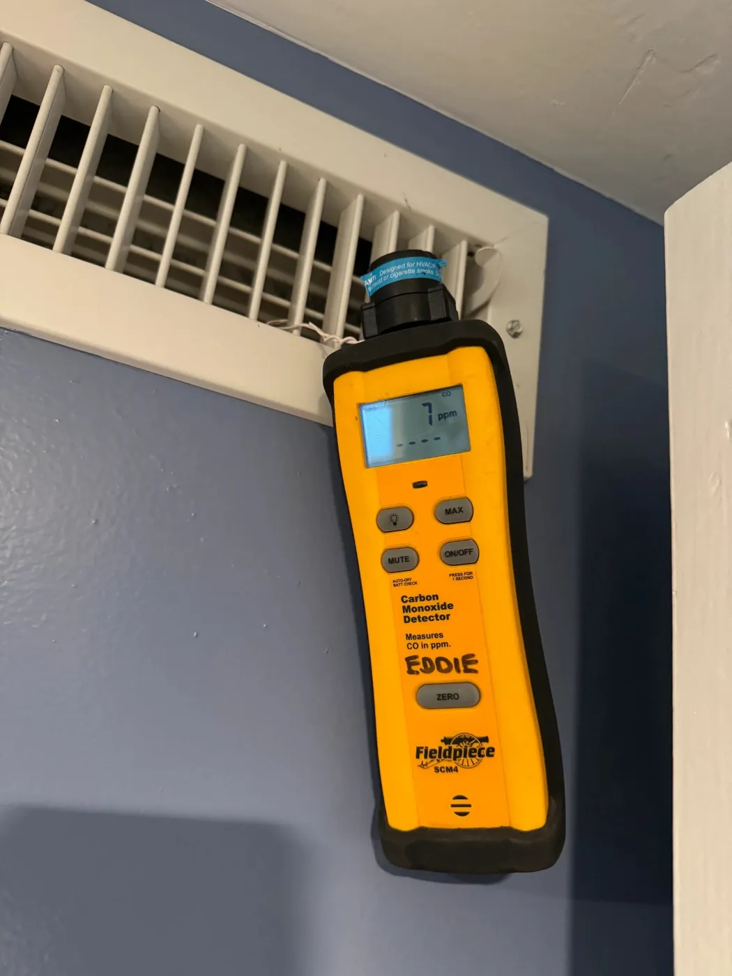 Carbon monoxide check at a supply vent during a CrossBreeze maintenance visit